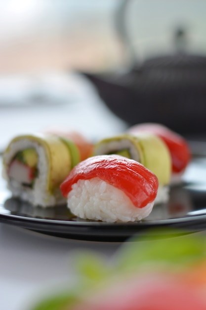 Dish with various types of sushi, some of bluefin tuna and other salmon