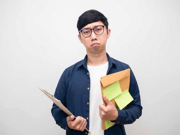 Disheartened businesssman with much workMan worker holding document tried with work