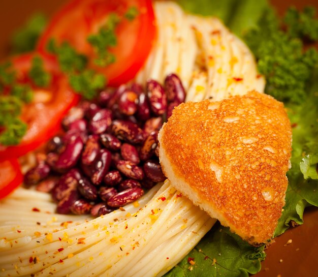 Dishes for a dinner it is decorated with fried bread in the form of heart.