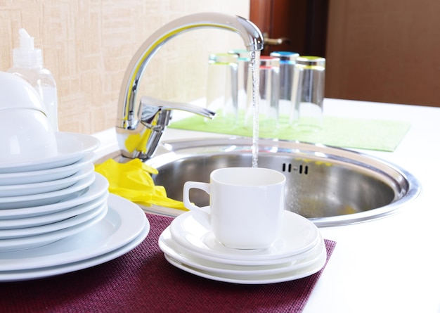 Dishes drying near metal sink