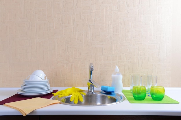 Dishes drying near metal sink