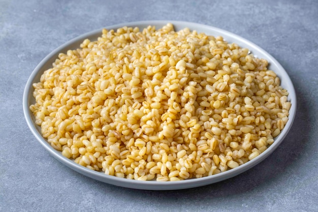 Dishes from traditional Turkish cuisine; head bulgur pilaf - whole bulgur wheat. Turkish name; Soganli bulgur pilavi or basbasi bugday pilavi