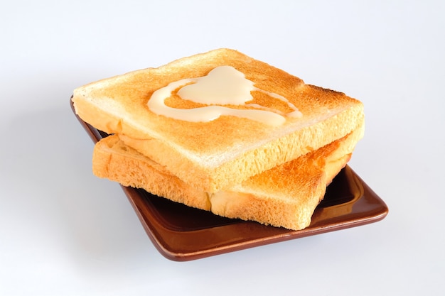 Dishware with many slices of toast with topping . Baking Bread.