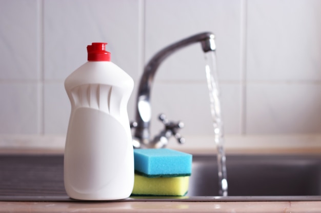 Dishwashing detergent close-up in the interior of the kitchen. High quality photo