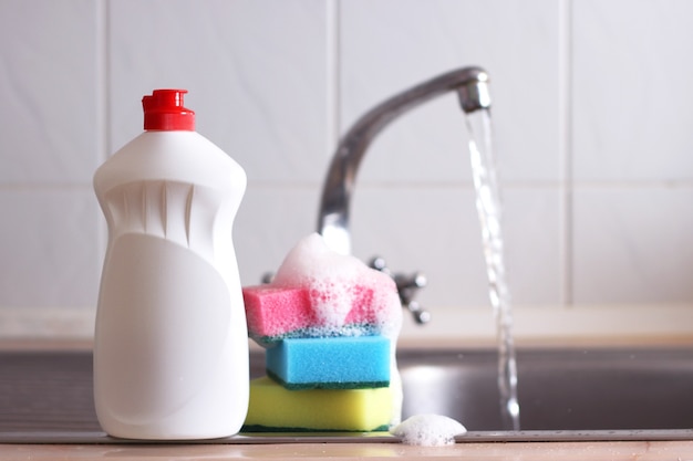 Dishwashing detergent close-up in the interior of the kitchen. High quality photo