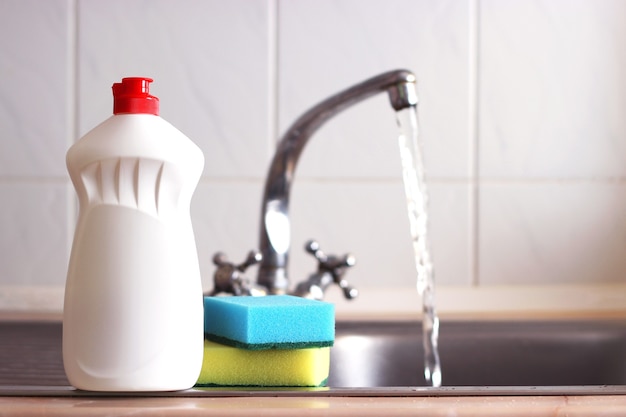 Dishwashing detergent closeup in the interior of the kitchen