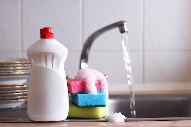 Dishwashing detergent closeup in the interior of the kitchen