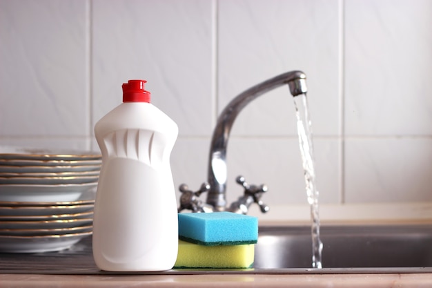 Dishwashing detergent closeup in the interior of the kitchen