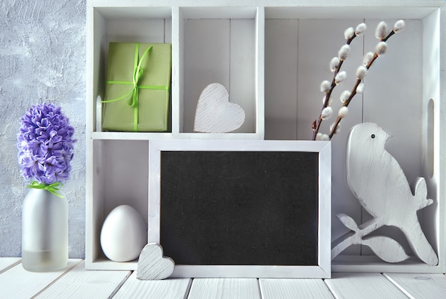 Display cabinet with Spring decorations, blue hyacinth and willow flowers