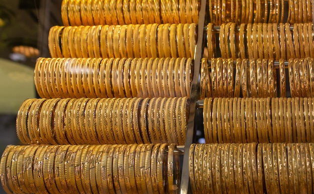 Display of dozens of golden bracelets in Turkish style