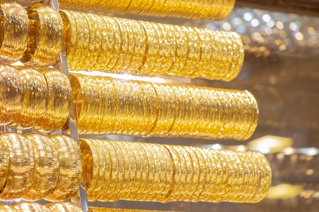 Display of dozens of golden bracelets in Turkish style