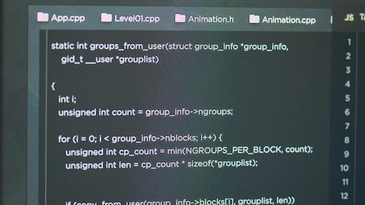Photo display of software developer typing database functions script on html terminal window in it agency office. computer showing programer writing source code and developing app. close up.