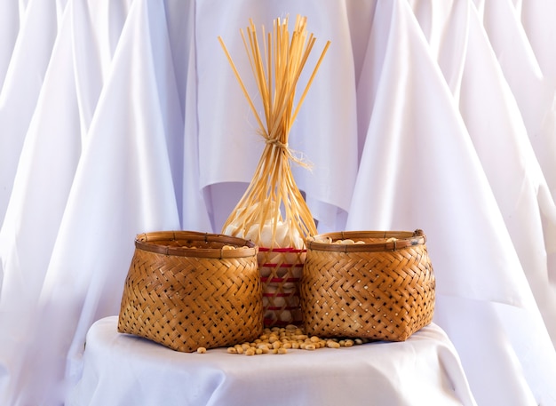 Display soybean protine in bamboo rattan basket on white fabric