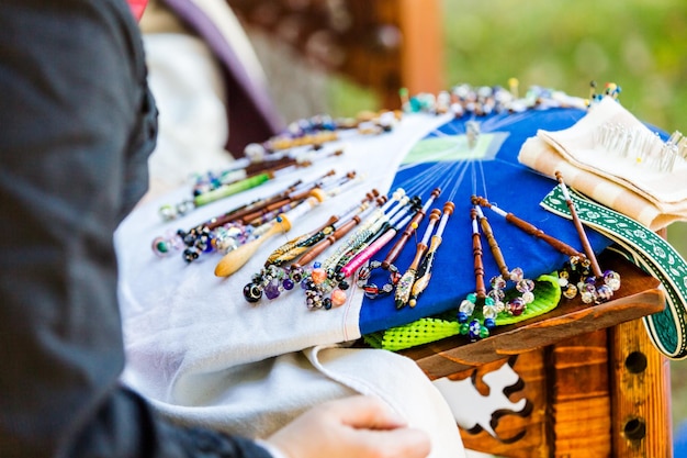 Display of vintage bobbin lace craft on historical ranch.