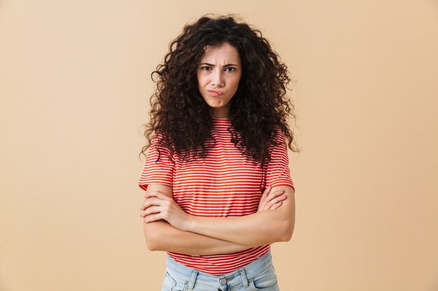 Displeased young woman with crossed arms