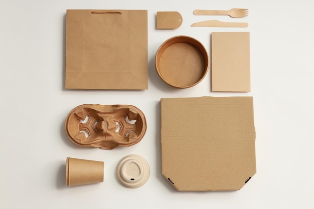Disposable blank tableware for food delivery on white background