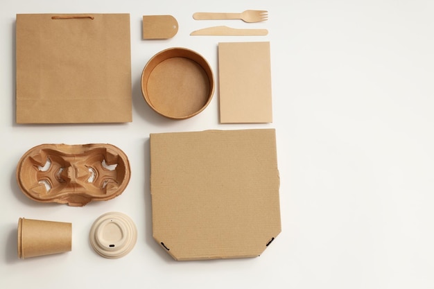 Disposable blank tableware for food delivery on white background