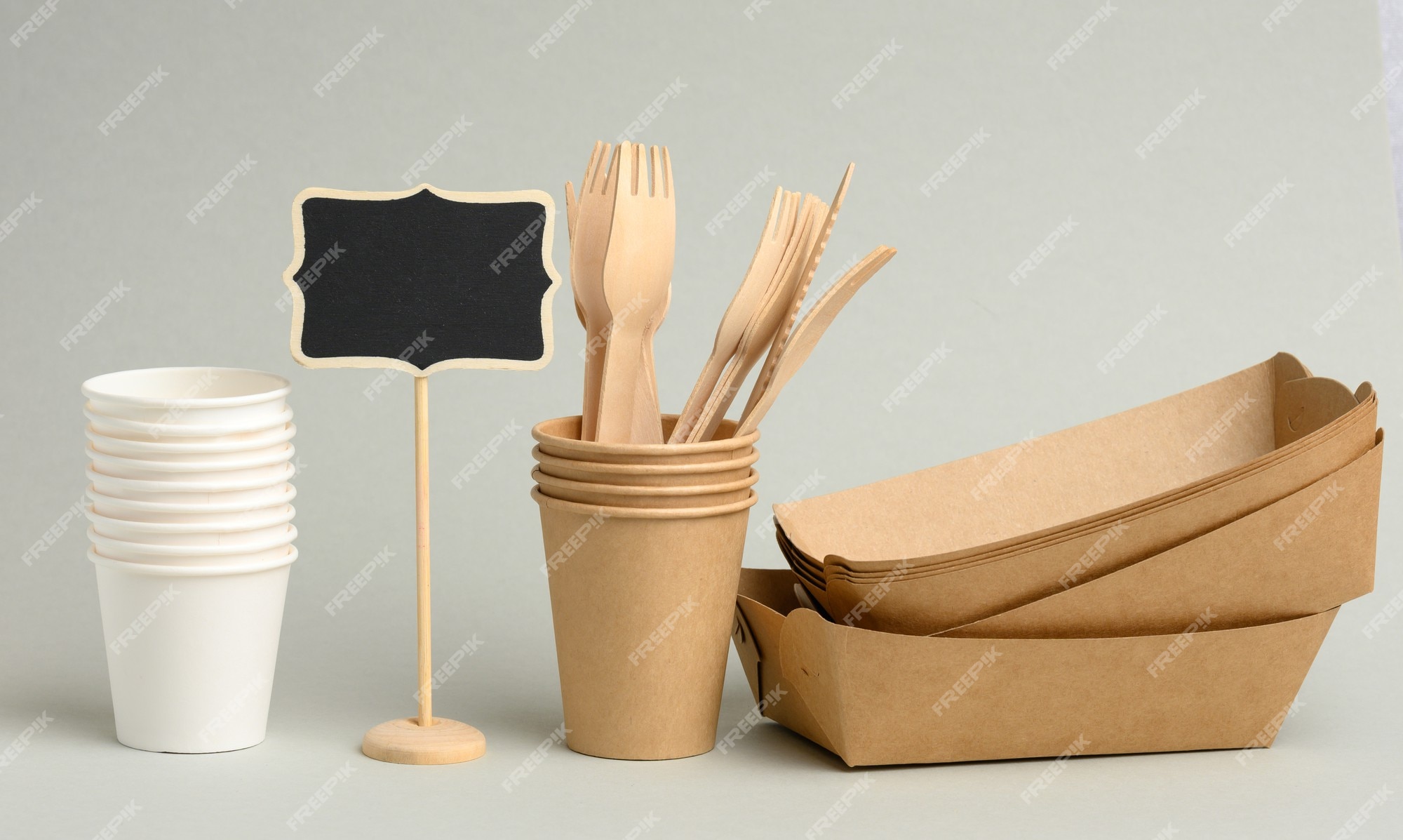 https://img.freepik.com/premium-photo/disposable-brown-white-paper-cups-rectangular-plates-wooden-forks-gray-surface-zero-waste-no-plastic_116441-17803.jpg?w=2000