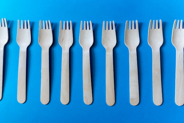 Disposable eco-friendly tableware. A set of several wooden forks.