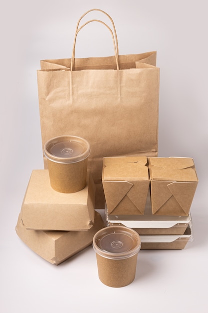 Disposable food delivery packaging on gray background