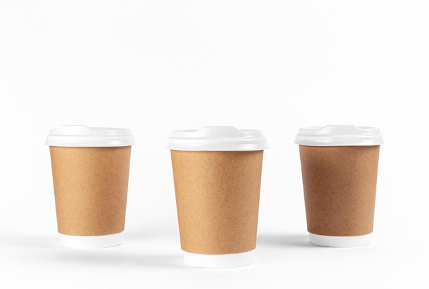 Disposable paper cups on a white background isolated