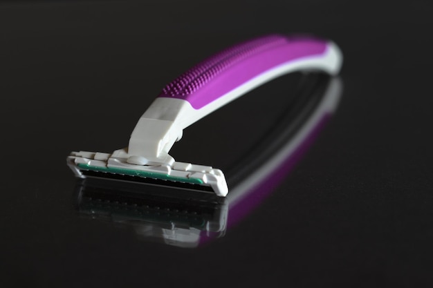 Disposable razor purple with mirror effect.