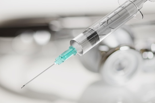 회색 배경에 백신 주입을 위한 일회용 주사기
