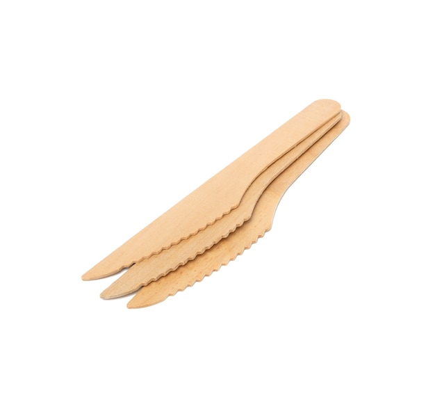 Disposable wooden knives for picnic and takeaway food isolated, close up