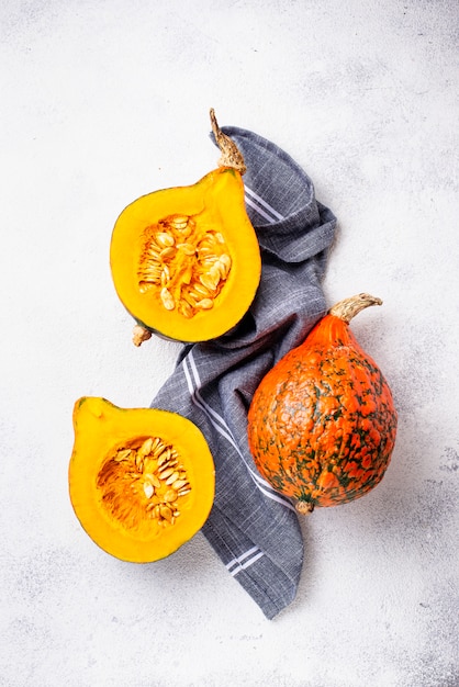 Dissected raw hokkaido pumpkin with seeds