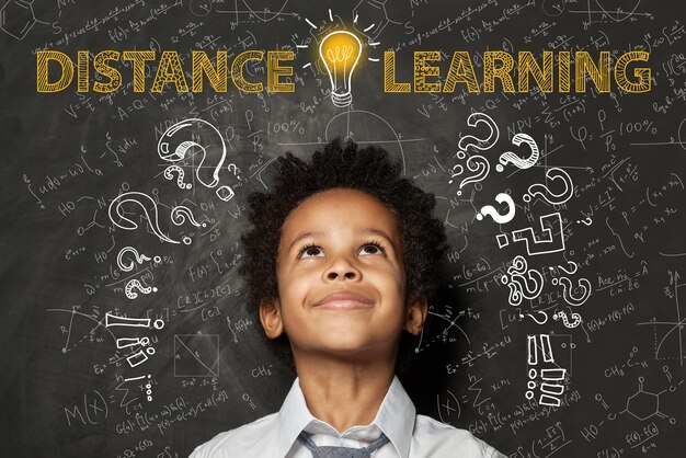 Distance learning Black child boy with idea light bulb question marks and science formulas