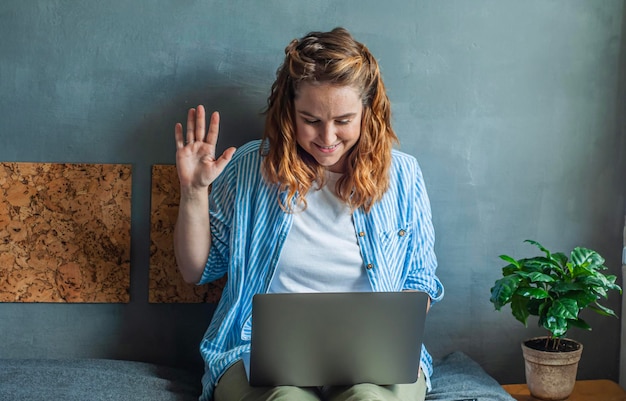 Distance learning courses university video communication at a\
distance girl raises her hand