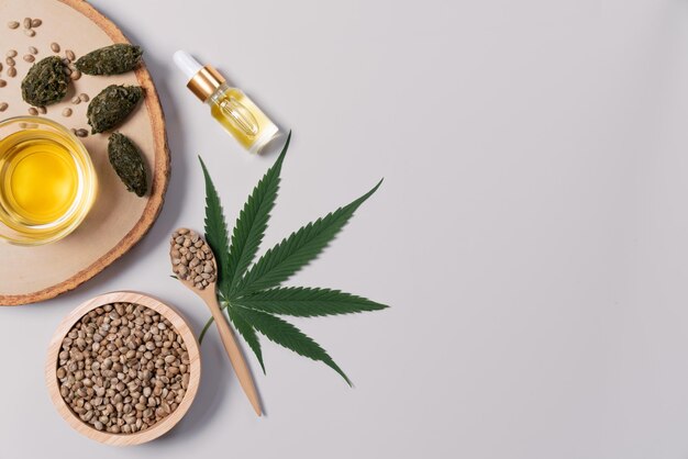 Distillation concept of CBD oil feature with hemp seeds on the white background