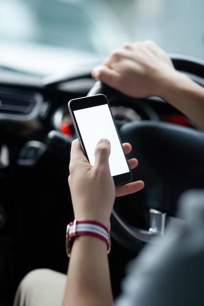 Distracted driving is a potential danger Closeup shot of an unrecognisable man using his cellphone while driving