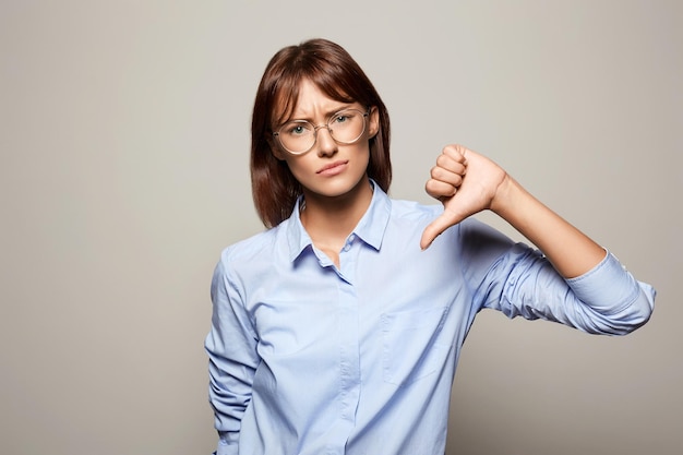 Distressed girl in glasses beautiful brunette woman