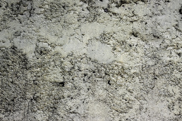 Distressed rough surface of an old concrete wall for texture background