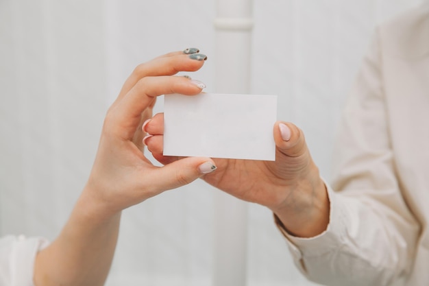 Distribution of contacts. the doctor gives the patient a business card of the dental clinic.