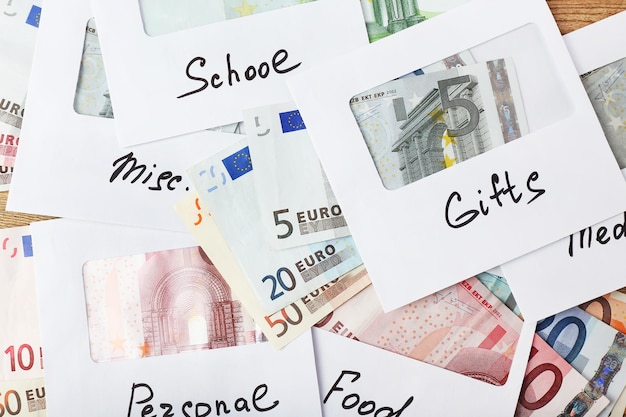 Photo distribution of money financial planning euro in envelopes closeup