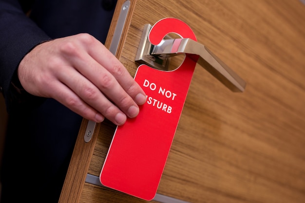 Do not disturb. Do not disturb sign hanging on the door in the hotel room