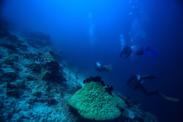 diver breathes air under water bubbles, releases gas, landscape underwater depth