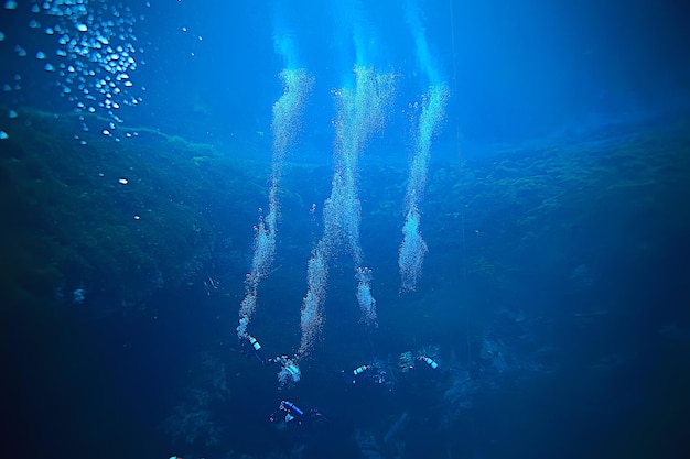 diver breathes air under water bubbles, releases gas, landscape underwater depth