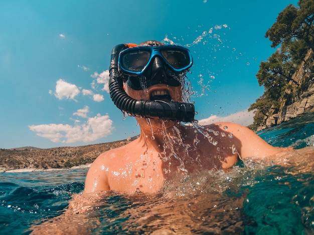 Diver emerge from the sea