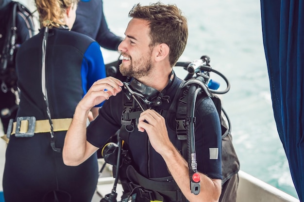 Diver prepares his equipment for diving in the sea