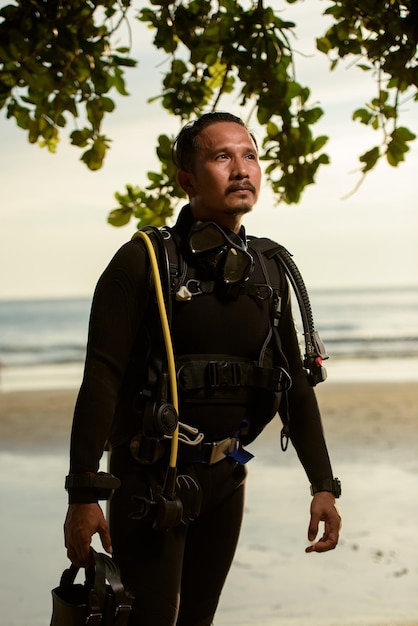 Diver rescue in wetsuit equipment for scuba diving the concept\
of sports recreation travel