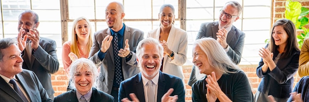 Diverse business people applauding with joy