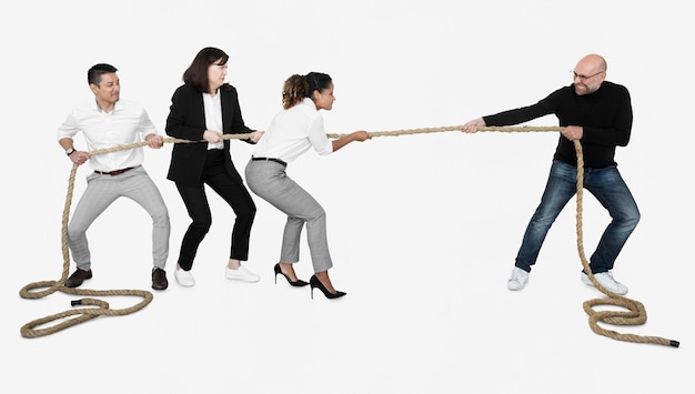 Photo diverse business people tugging on a rope