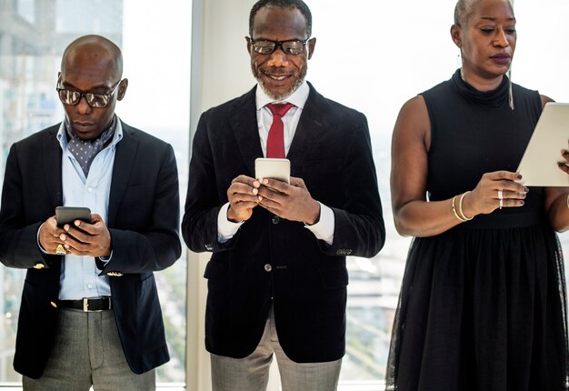 Photo diverse business people use digital devices