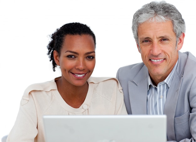 Diverse business people working at a computer 