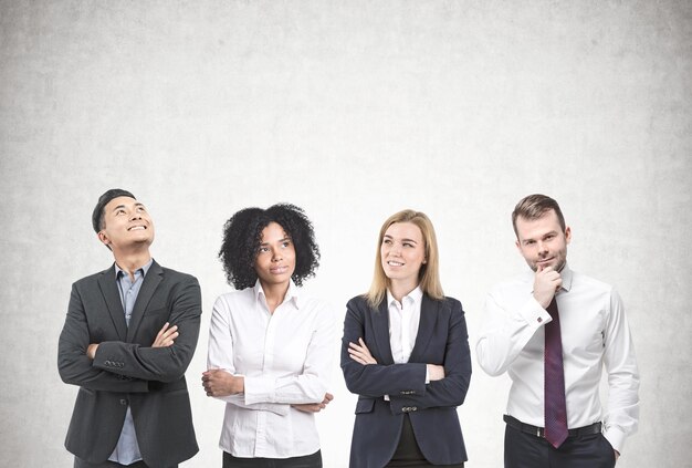 Photo diverse business team brainstorming concrete