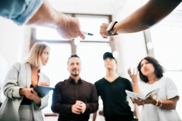 Diverse businesspeople in a startup company brainstorming in a meeting