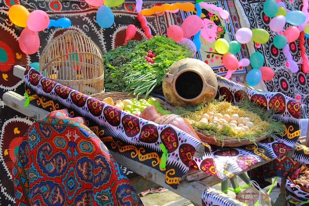 A diverse collage of vegetables and fruits on an old horse cart.